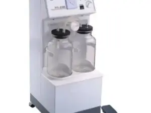 Medical suction device with two glass collection bottles control panel on top mounted on wheels with a foot pedal accessory beside it