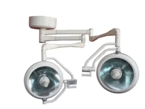 Two round, ceiling-mounted surgical lights on adjustable arms for an operating room setting