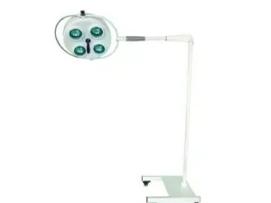 Mobile surgical light on a wheeled stand with a round lamp head and multiple green lights, used in operating rooms to illuminate procedures.