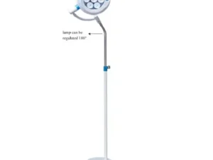 Surgical lamp on a tall adjustable stand with a round, multi-bulb head; head rotates 180 degrees.