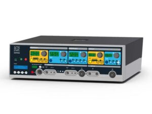 Front view of a multi-module medical console with bright green numeric displays and blue/yellow panels, multiple knobs and connectors on a gray casing, branding on the left.